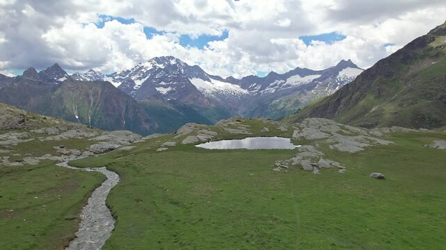 Flying above Piani di Fora in Valmalenco with Disgrazia massif on the horizon