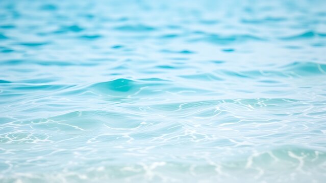 Serene turquoise waves gently lapping the shore of a tranquil Maldives beach.
