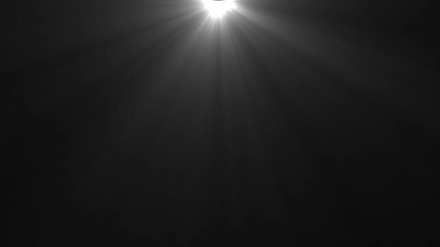 Light rays and sun ray light effects. Sun rays view, spotlight glowing burst concept. Abstract light rays emanating from on black background.
