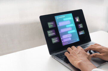 Fototapeta premium Typing on Laptop with AI Assistant chatbot Interface Screen