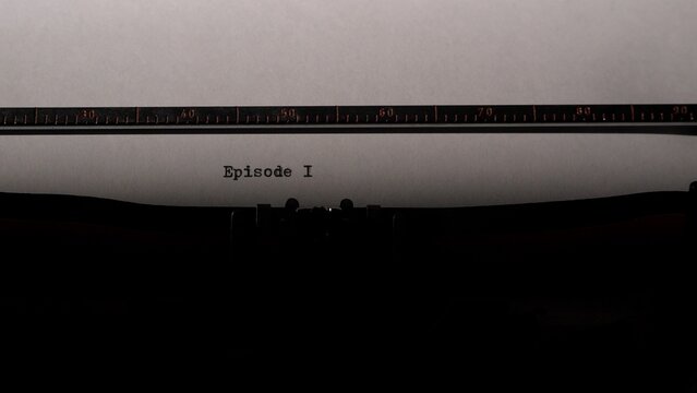 Typewriter mechanism typing the words episode i onto a fresh sheet of white paper, conveying concepts of new beginnings, scriptwriting, and creative storytelling in a vintage style
