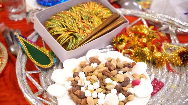 Beautiful mehndi thaal decorated with marigold flowers, bridal bangles, and traditional accessories &mdash; perfect for Pakistani and Indian wedding ceremonies and festive celebrations.