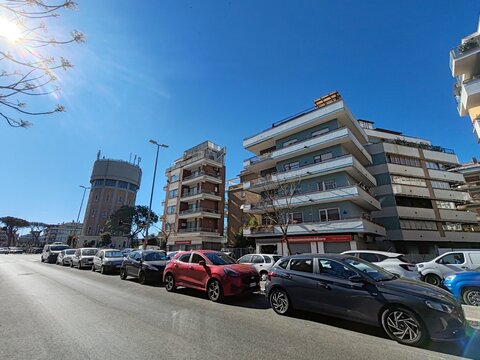 Ostia, Rome, Italy - June 20, 2026, a complex of buildings with the Acea Tower in Ostia, with the tower of the Ostia Batteria Alto water center, by Acea S.p.A.
