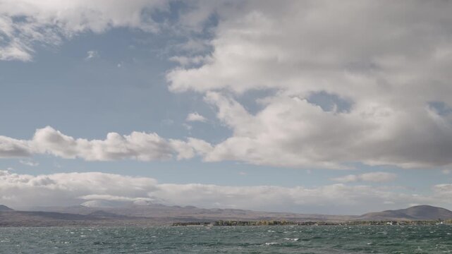 Slow motion handheld footage of lake Sevan in Armenia windy autumn season