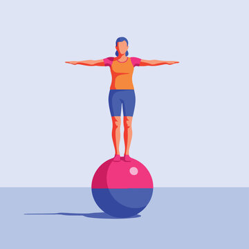 Person balancing on a large stability ball in a studio