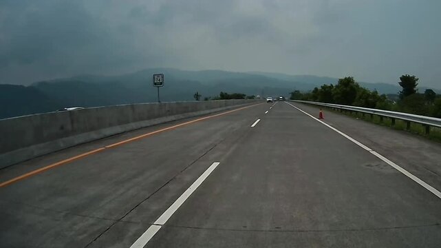 Traveling Along Malang Toll Road Through Mountain Landscape in East Java