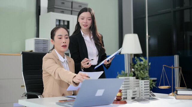 Business team consulting on real estate deal with building model, contract, and calculator. Ideal for property investment, legal agreement, and finance themes.
