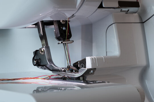 Overlock sewing machine foot with two needle at the top and support with a view from a diagonal left