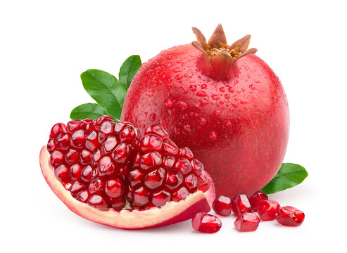 Pomegranate with slice isolated on white.