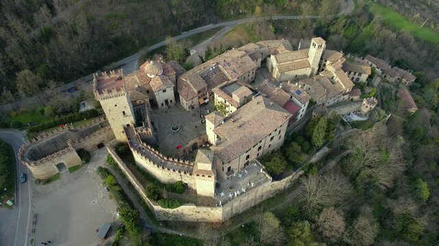 Drone view footage of Vigoleno Castle and medieval village in Vigoleno, Italy. Historic fortified hilltop destination in Emilia Romagna, ideal for tourism, travel, lifestyle and cultural vacation 
