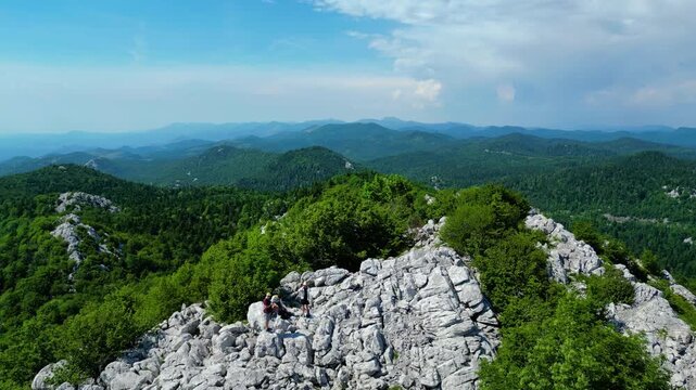 Lush green mountains and rocky karst formations overlook the serene blue waters of Kvarner Bay, Croatia. An expansive aerial view capturing the Adriatic's natural beauty. Medvi?ak