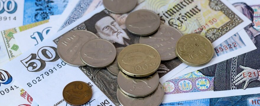 Icelandic krona money bills and coins on table. Iceland cash of ISK currency close up