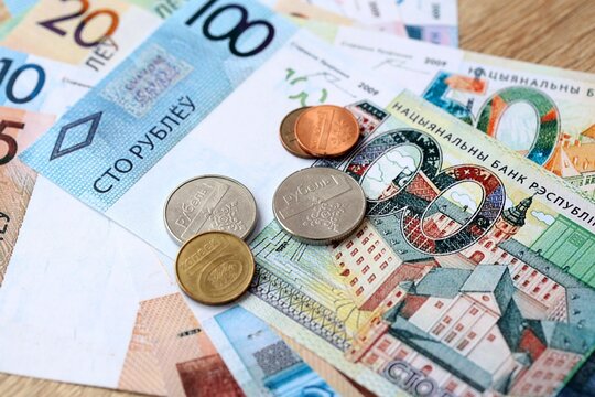 Belarusian ruble money bills and coins on table. Belarus cash of BYN currency close up