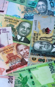 Malawian kwacha money banknotes bunch on table. Malawi bills of MWK currency