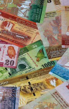 Sri Lankan rupee money banknotes bunch on table. Sri Lanka bills of LKR currency close up