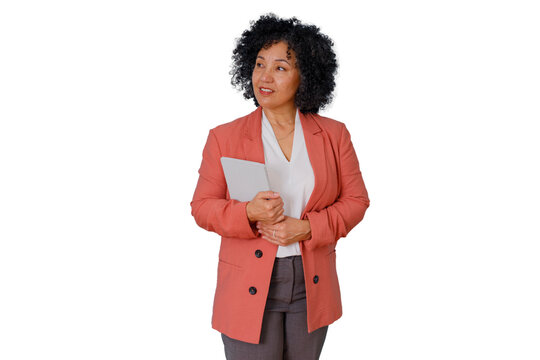 Middle-aged professional woman in a blazer standing and holding a notebook, looking thoughtfully to the side