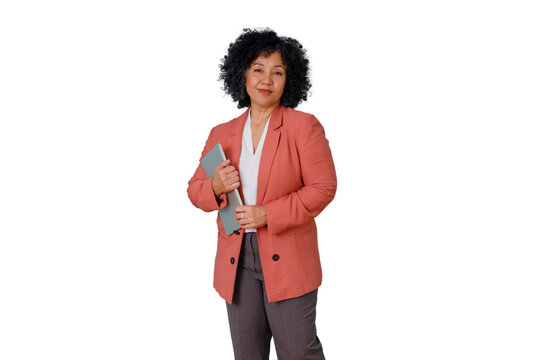 Mature businesswoman holding laptop, smiling, showing confidence and leadership, standing on a transparent background