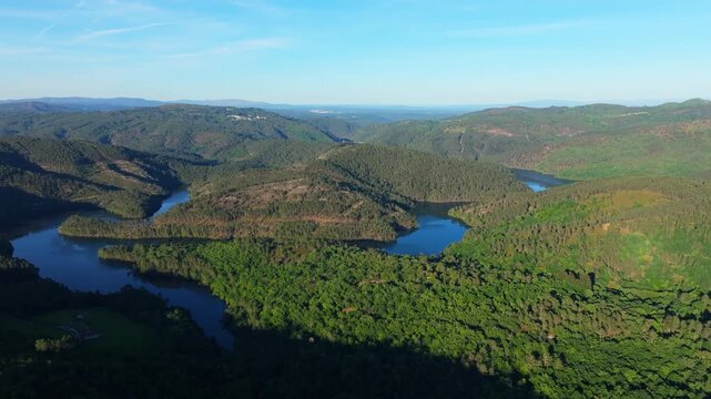 The Miradoiro do Castro Viewpoint Overlooking Forested Mountains And Avia River In Avi&oacute;n, Ourense Province Of Galicia, Spain. Aerial Wide Shot