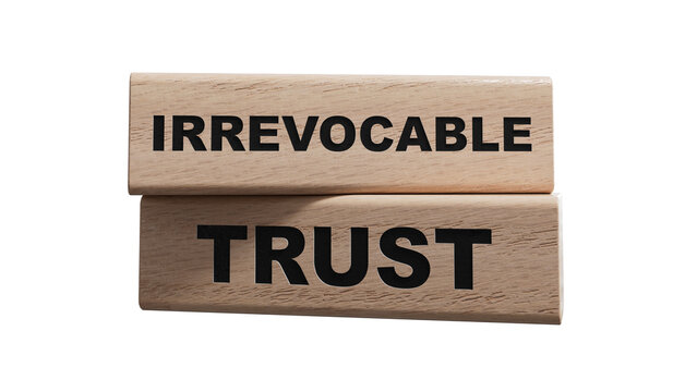 Text IRREVOCABLE TRUST writing in wood cubes. Business concept. wood cubes. Copy space.Supports PNG files with transparent backgrounds.