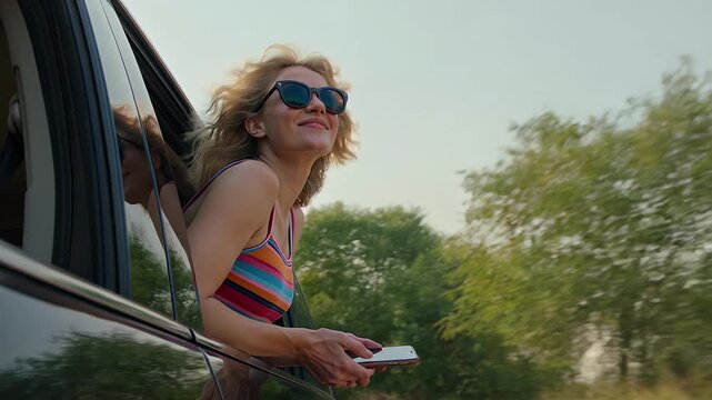 Road trip woman and laughing in car with smartphone for travel, summer vacation and holiday adventure. Female passenger, sunglasses and freedom in vehicle with transport, joy and leisure trip