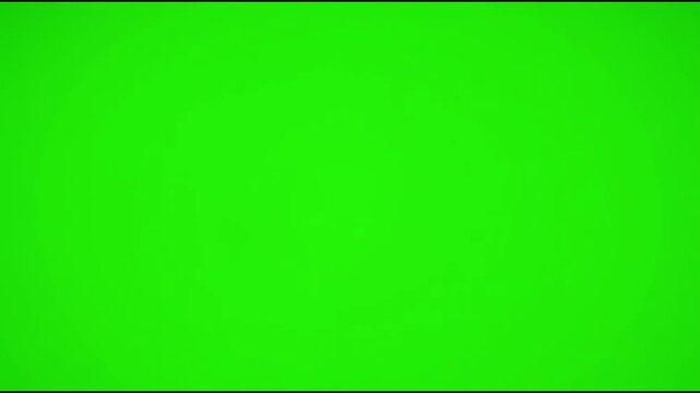 Colorful Jelly Candies Falling in Midair Against Bright Green Background