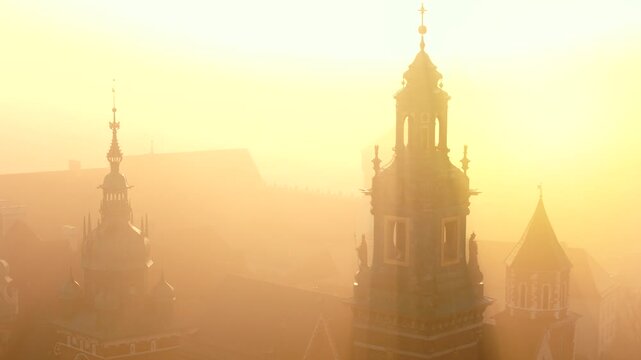 Aerial view of Wawel Castle during foggy sunrise, Krakow, Poland