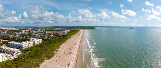 Aerial Panorama of Cocoa Beach Coastline Facing North Toward Port Canaveral and Cape Canaveral Space Coast, Florida, USA. June 27, 2022.  © JHorsey