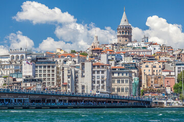 Obraz premium Galata Tower rising above the historic Beyoglu district skyline in Istanbul, Turkey