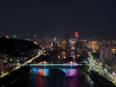Lanzhou China Night Skyline with Illuminated Bridge over the Yellow River