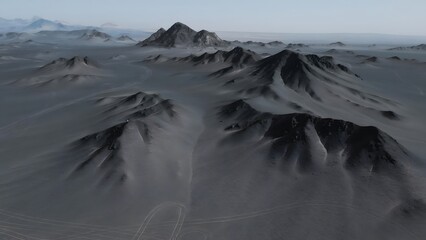 Aerial view of black volcanic mountains in a barren desert landscape © Ngo