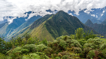 Fototapeta premium Dramatic green Andes mountains and cloud forest landscape near Machu Picchu Peru