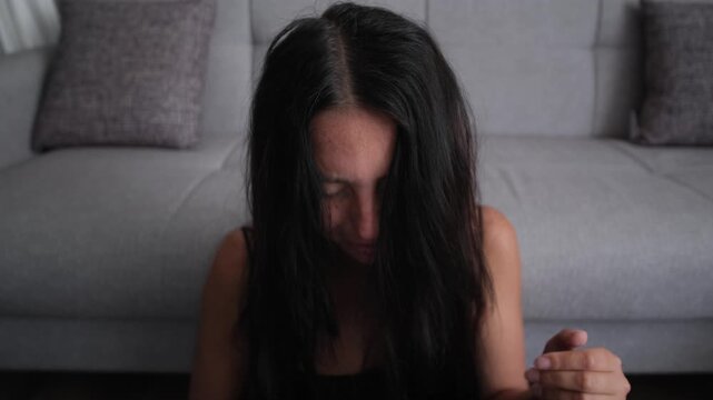 Close up emotional aftermath with depressed woman crying after toxic digital relationship conflict, emotional overload, mental stress and psychological vulnerability