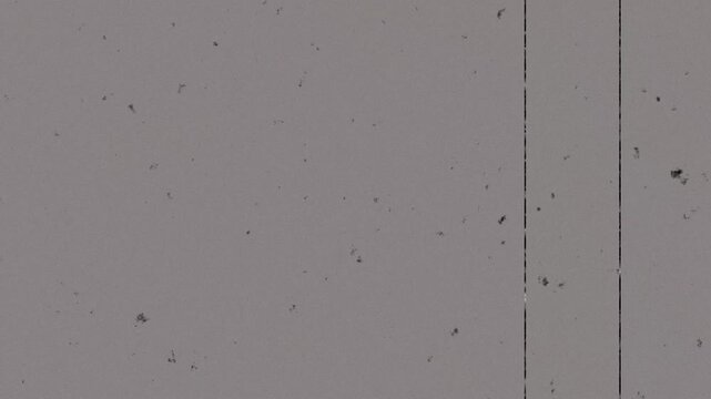 Cinematic Retro Film Grain Overlay Featuring Aged Dust Particles and Vertical Scratches for Vintage Aesthetic 4k video