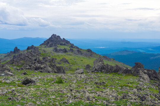 Mountain landscape with green grass and rocks