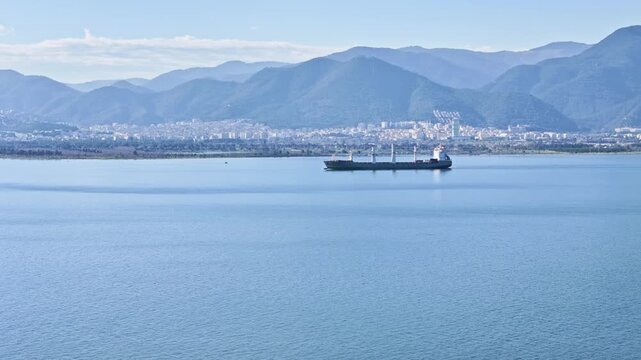 Cargo ship underway on calm sea. Aerial footage for supply chain, freight transportation and global shipping network