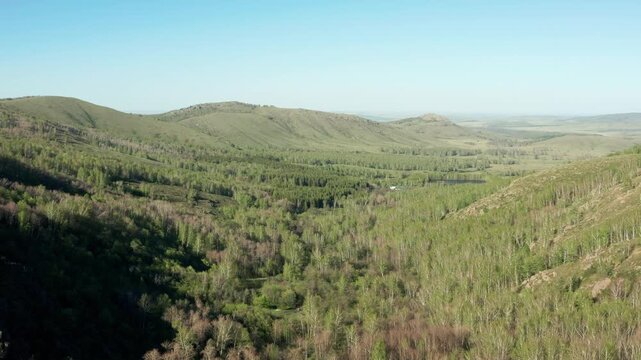 Southern Urals in spring: the Irendyk ridge and the Khudolaz River. Aerial view.