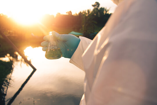 Field technician collecting groundwater samples for scientific testing and environmental assessment.