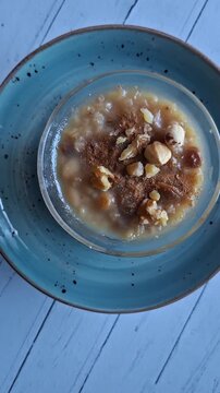 Traditional Turkish Ashure Dessert with Walnuts, Hazelnuts and Cinnamon
