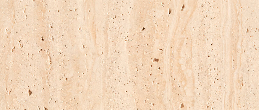 Natural beige travertine stone texture background with soft veining pattern