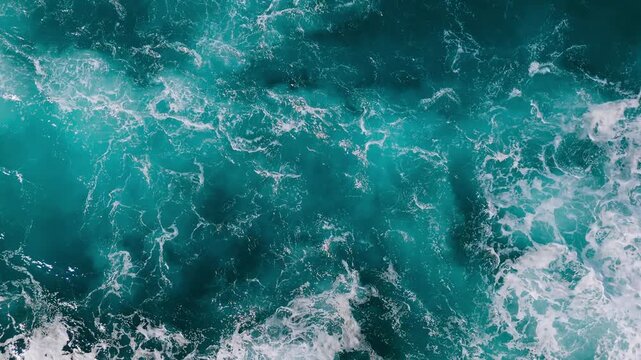 Abstract view of ocean waves and foam creating a dynamic natural background