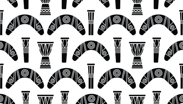 Seamless pattern of traditional tribal items like boomerangs and drums in a monochrome black and white minimalist graphic style.