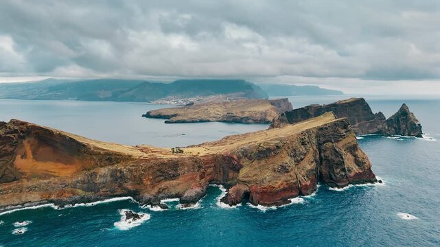 Aerial view of the Sao Lourenco peninsula extending from Madeira Island into the Atlantic Ocean with a clearly defined headland shape