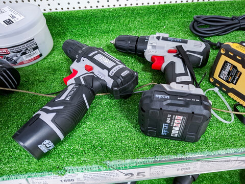 VORONEZH, Russia - April 04, 2026.Bulat cordless lithium drills displayed on shelves in a supermarket in Russia for customers to view and purchase during shopping hours