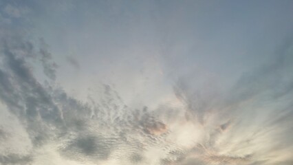 Fototapeta premium Beautiful white clouds scattered across a bright blue sky. Natural sky background and texture.