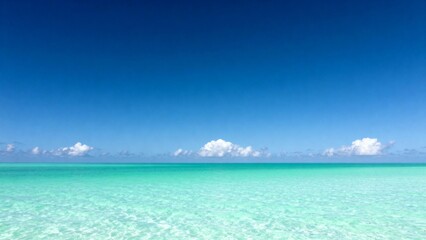 Fototapeta premium Clear blue sky over turquoise ocean