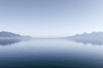 Fototapeta premium Serene mountain landscape with calm water and clear blue sky