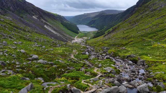 Hiking in Ireland, aerial view of Glendalough valley with a lake and a winding river, Wicklow, Ireland, tourism in Ireland, aerial view of Irish Glendalough 