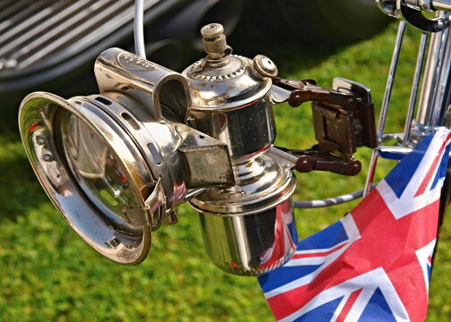 Vintage bicycle carbide lamp with Union Jack flag