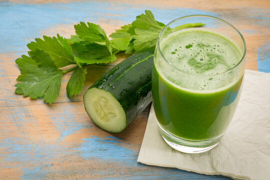 Fresh Green Cucumber and Celery Juice &ndash; glass of healthy vegetable juice with cucumber slice and celery leaves, symbolizing detox, nutrition, vitality, and a healthy lifestyle.