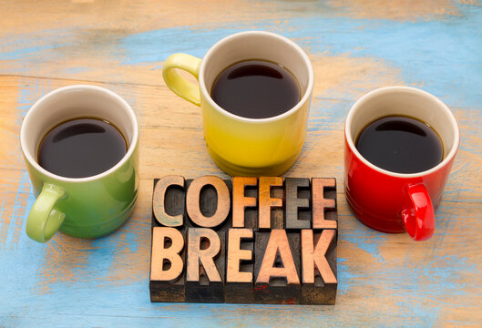Coffee Break &ndash; text in vintage grunge letterpress wood type printing blocks with three cups of black coffee, symbolizing pause, focus, simplicity, and mindful rest.